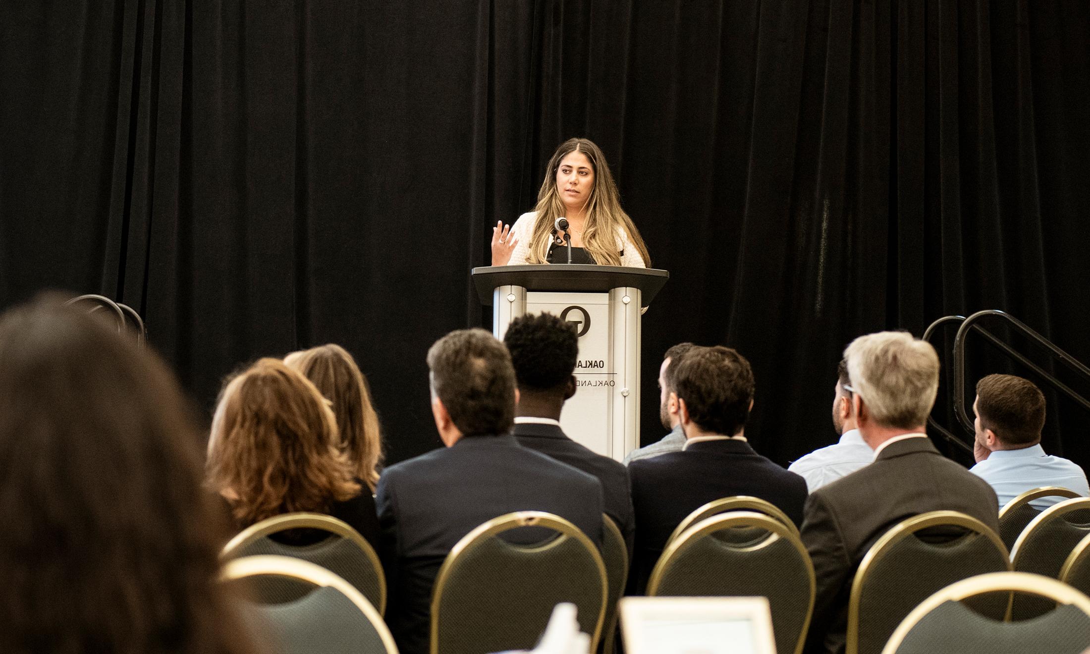 An image of Dr. Thomas speaking during the memorial