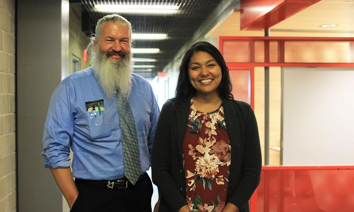 A man and woman smiling.