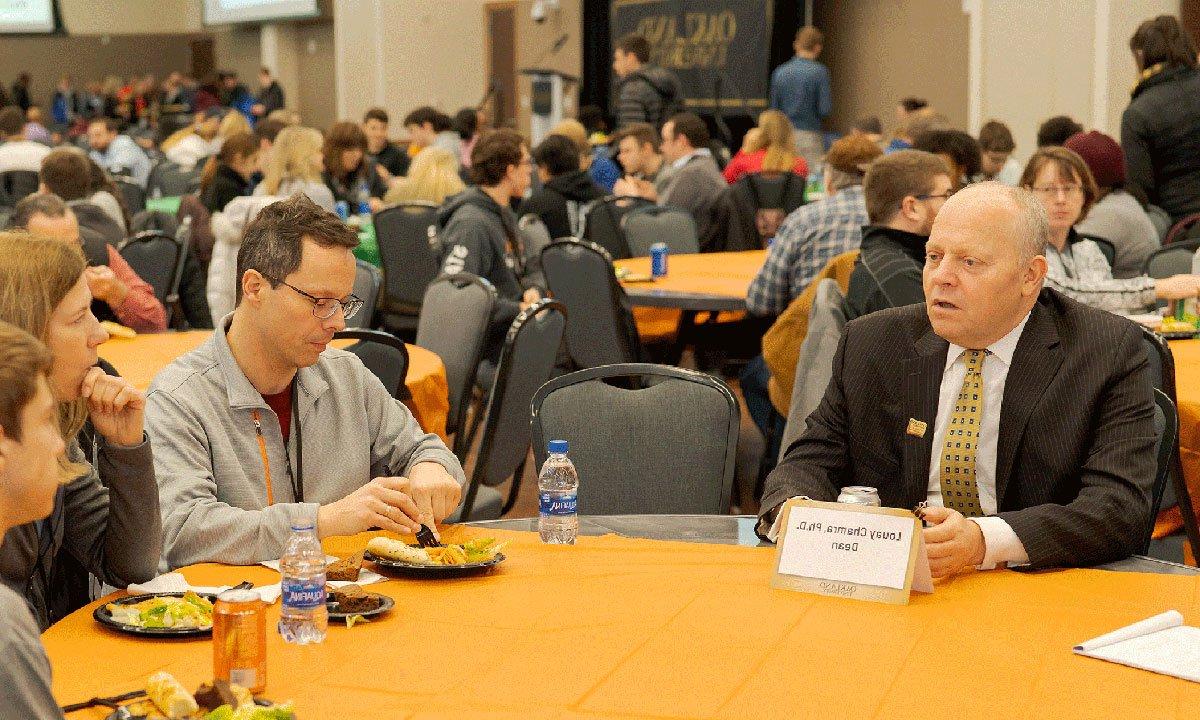 People at a table talking.