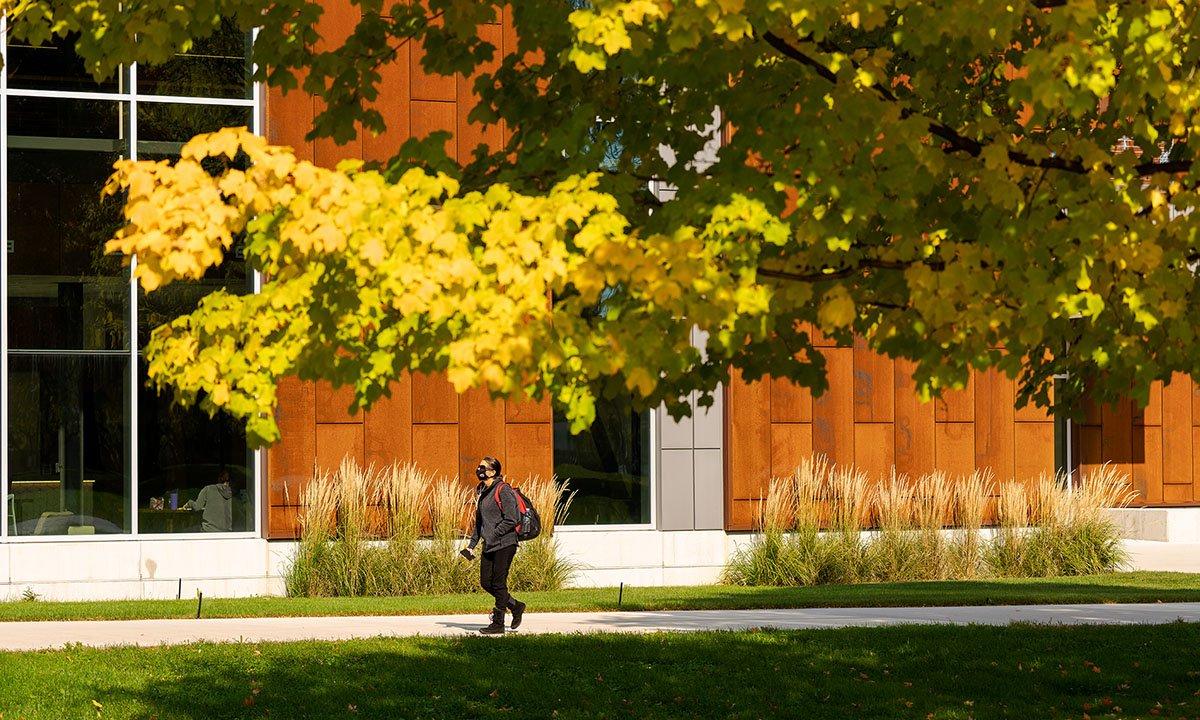 Student walking outside on campus