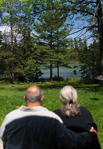 Man and woman looking out over lake