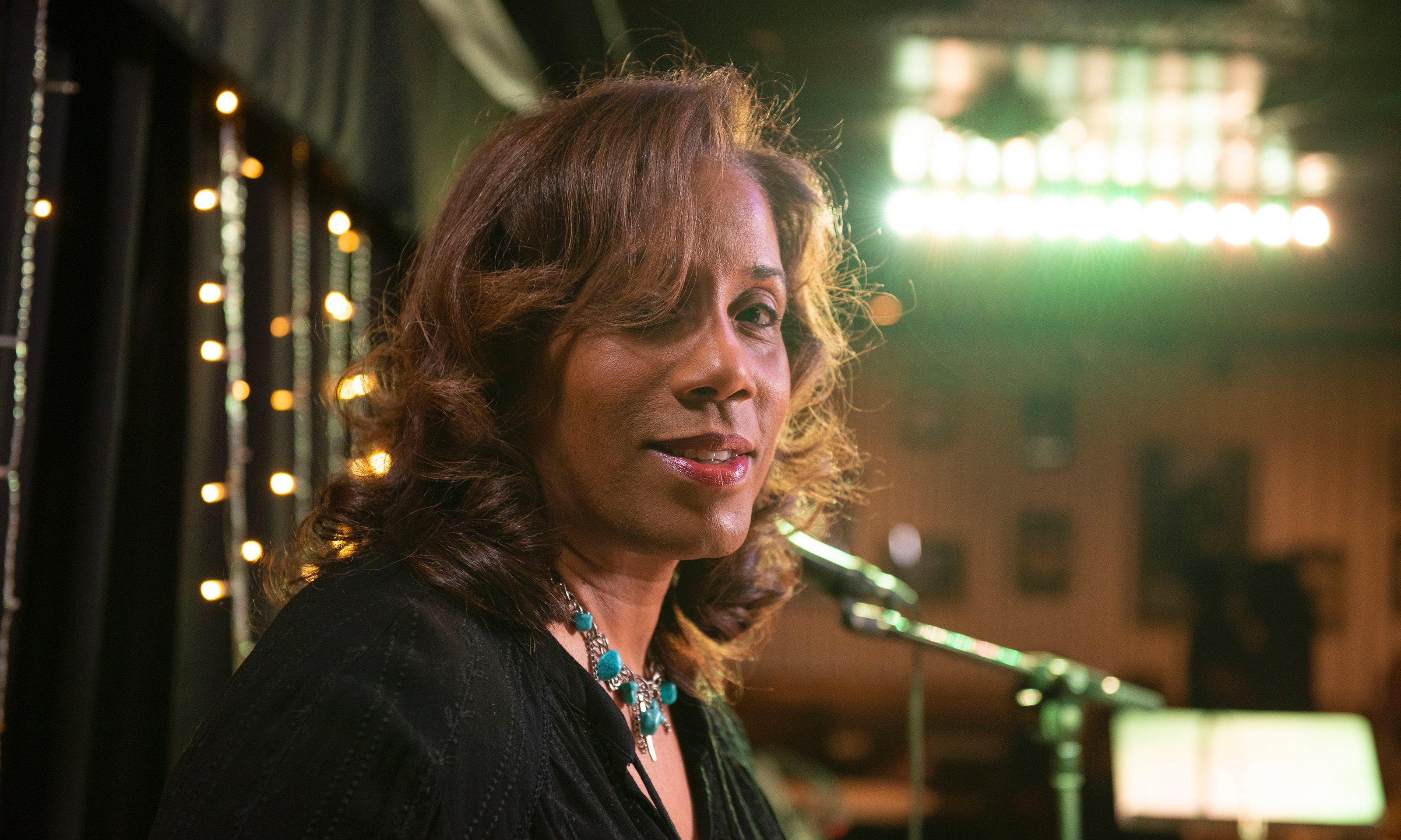 Headshot of a woman on stage