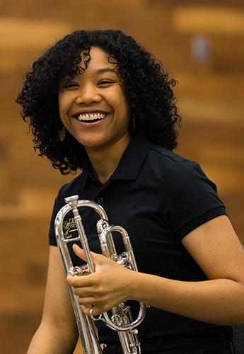 Woman holding trumpet